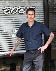 Owner standing outside shop